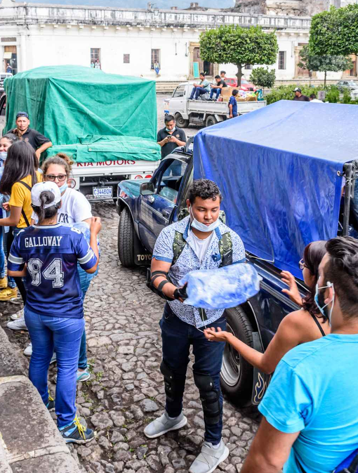 Human chain loading up a truck with disaster relief items