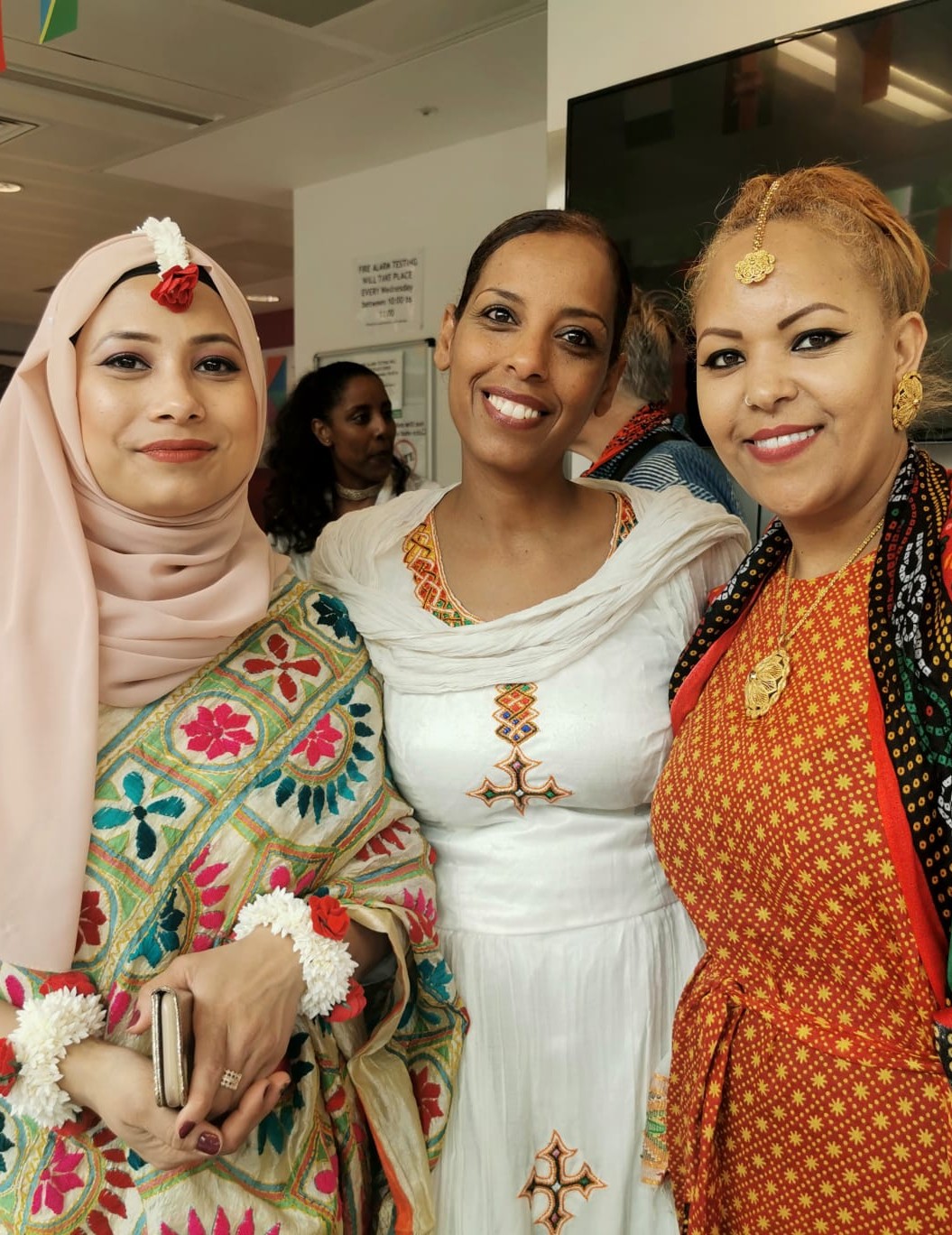 Three women smiling at the Somers Town Community Association
