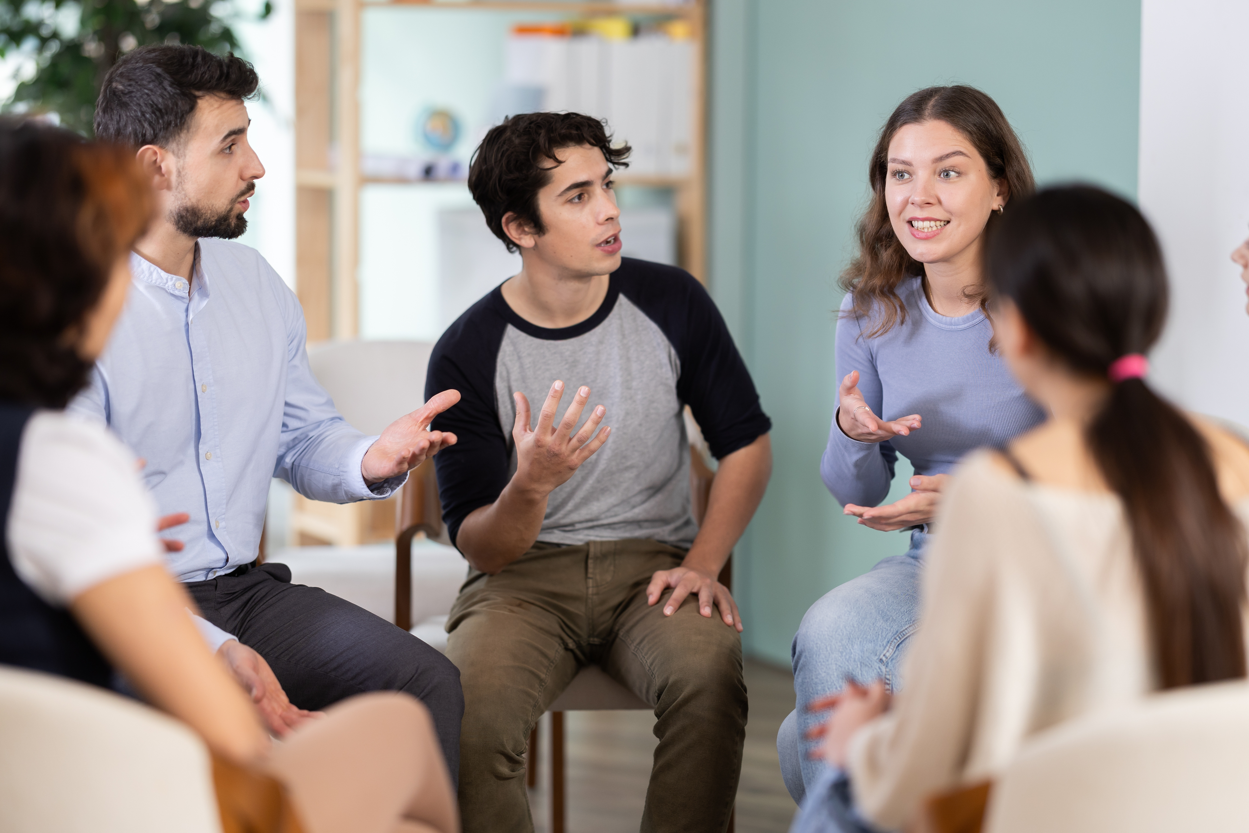 Five people having a discussion