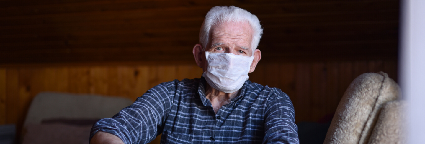 old man wearing a mask