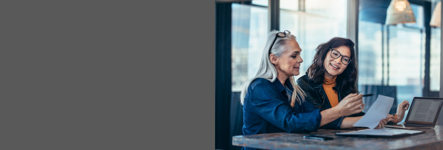 Two women at desk having a planning meeting 