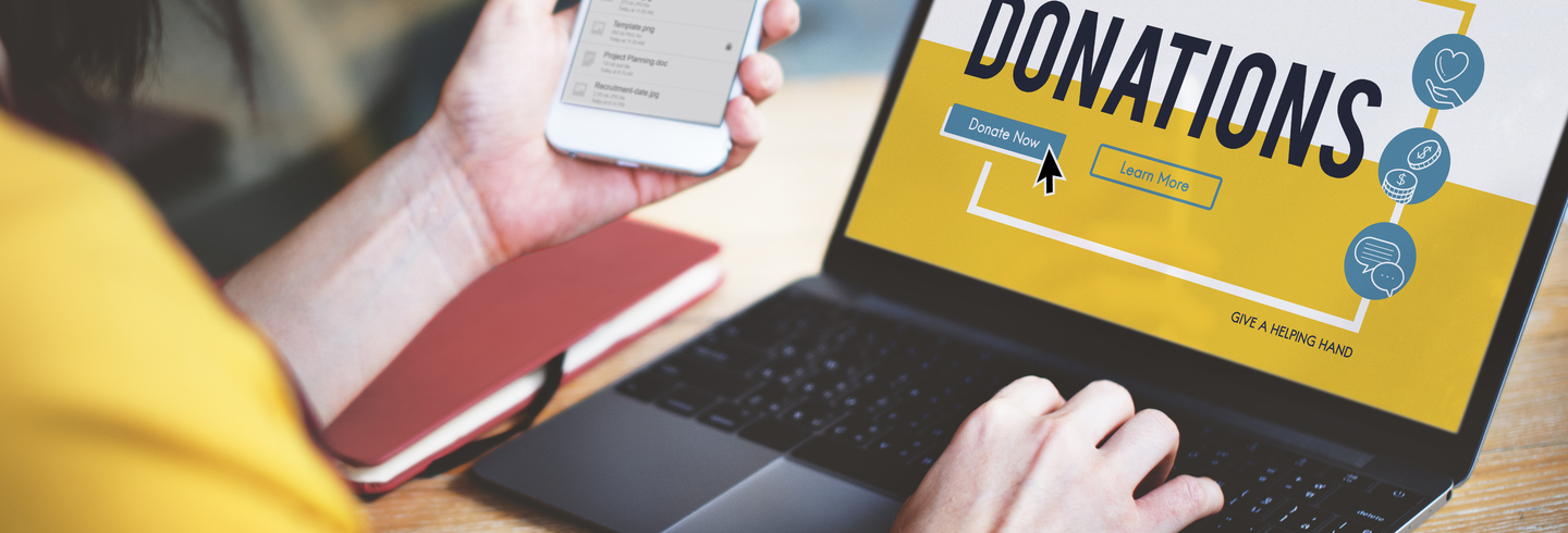 Woman making an online donation on her laptop