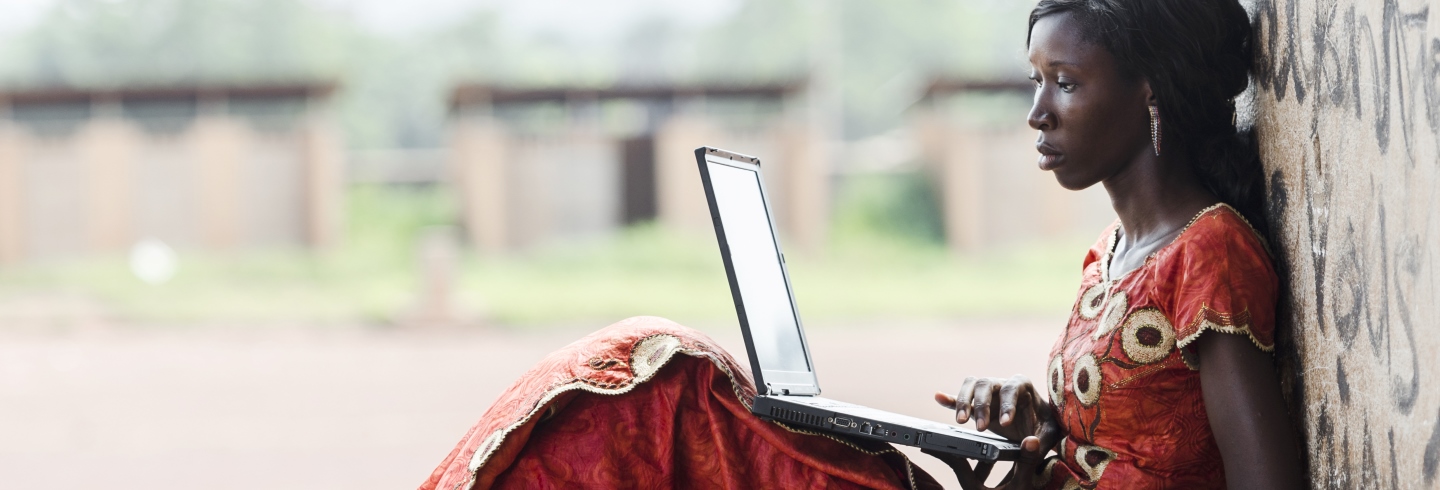 African woman using laptop
