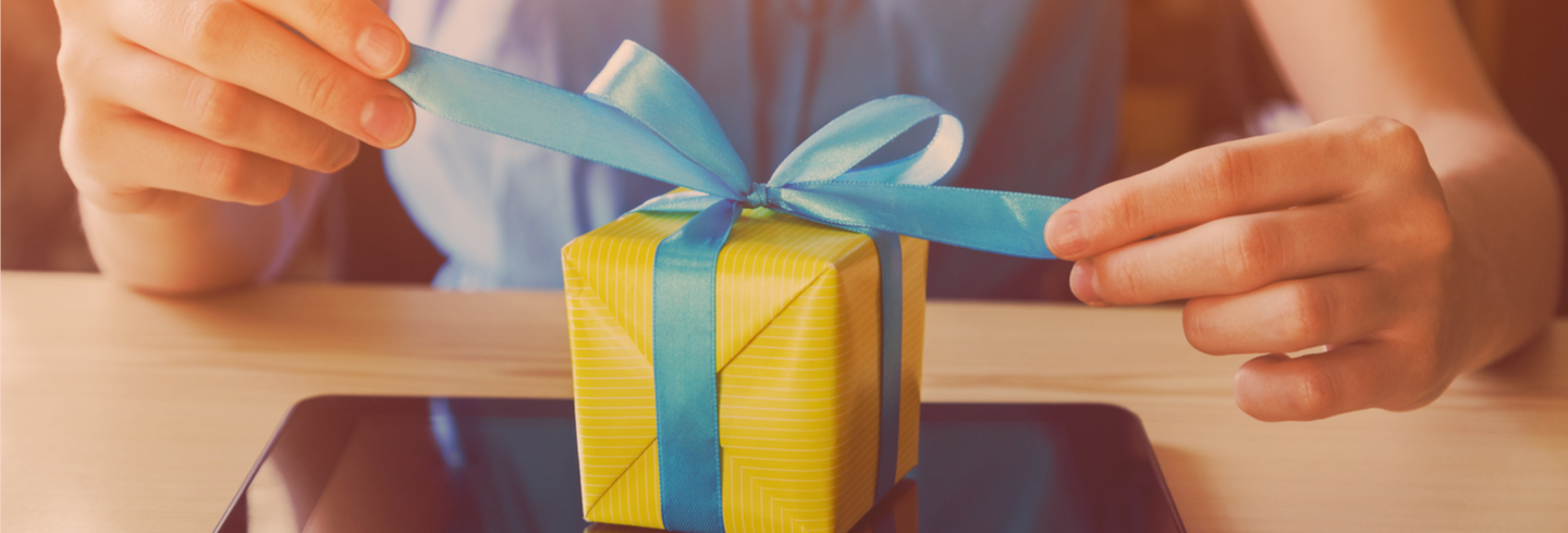 A gift box on top of a mobile tablet